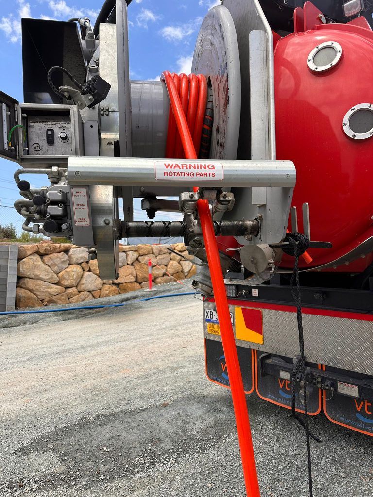 Vacuum truck cleaning storm water pipes with precision