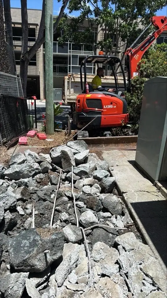 APU operator driving an excavator in Brisbane for a Project with GAP Industries